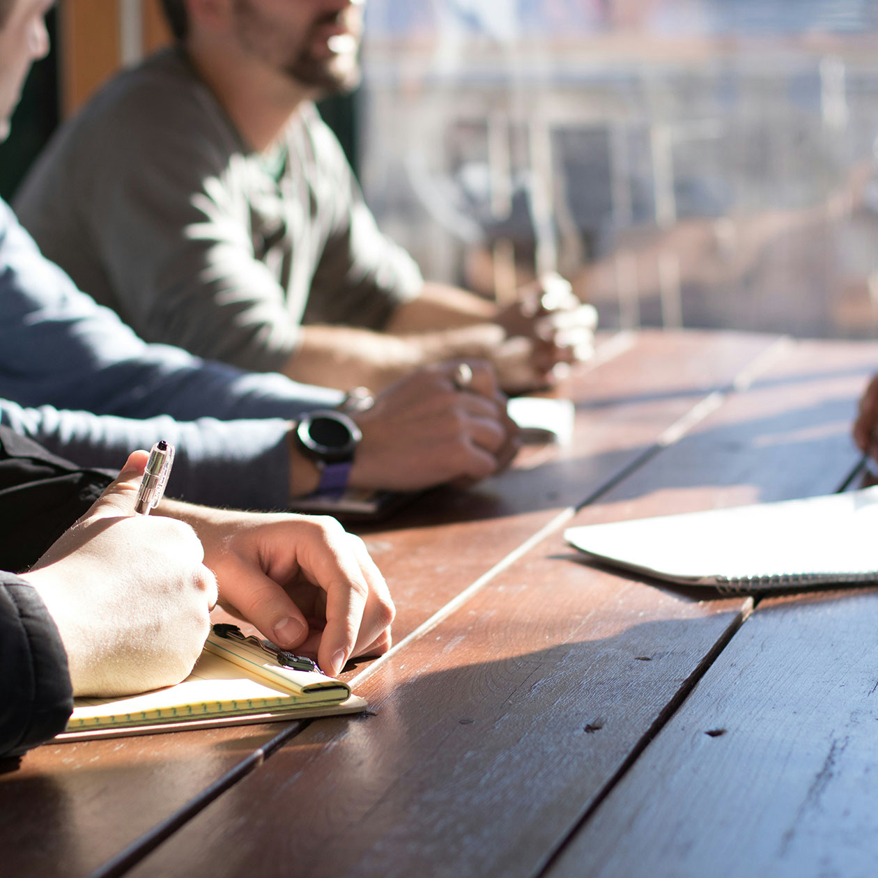 Placeholder image of several people in a meeting